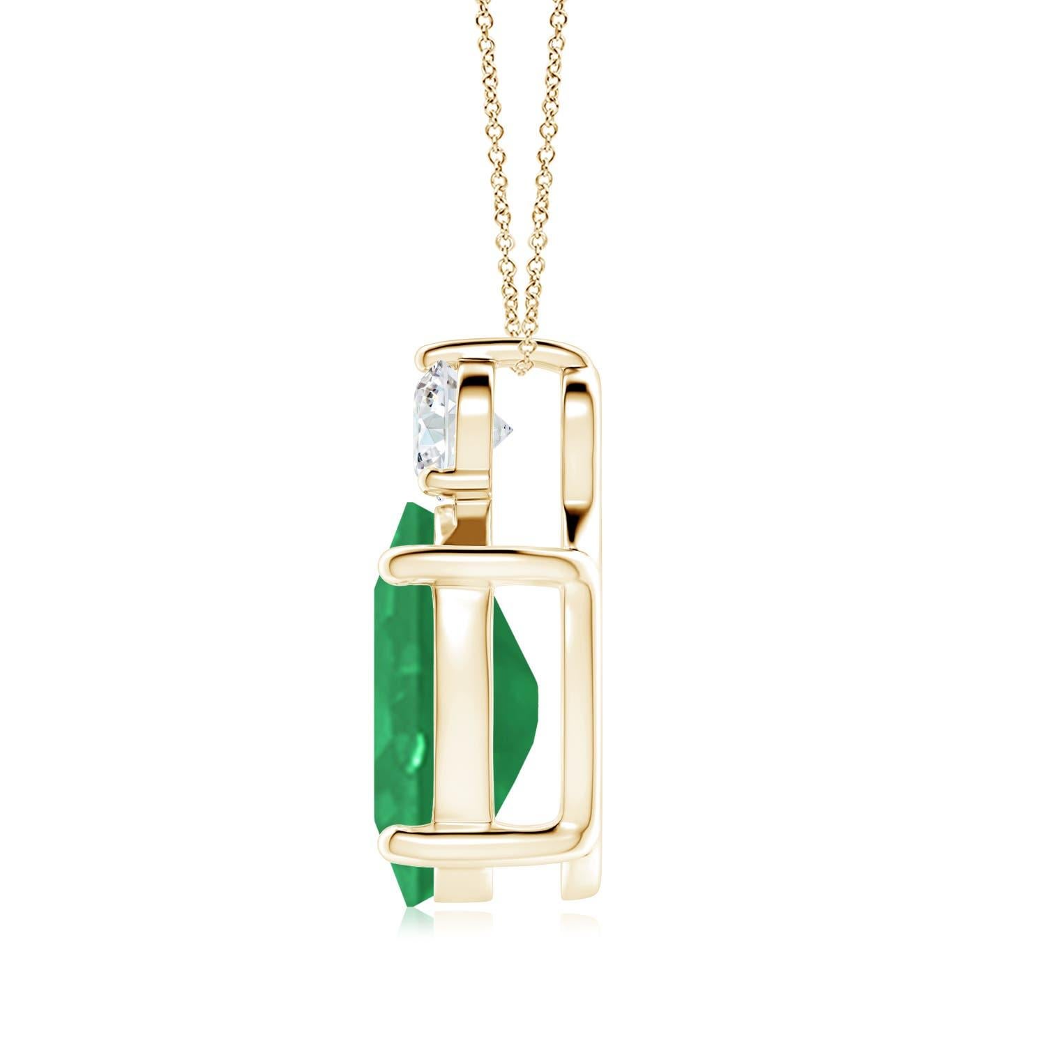 Crafted in 14k yellow gold, this classic solitaire emerald pendant personifies elegance. The rich green oval emerald is topped by a sparkling diamond for added allure. The intricate scroll work on the sides enhances this prong set emerald pendant's