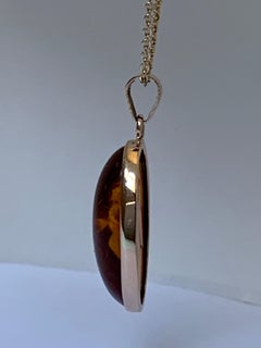 Natural Oval Amber Set in 14 Karat Gold
