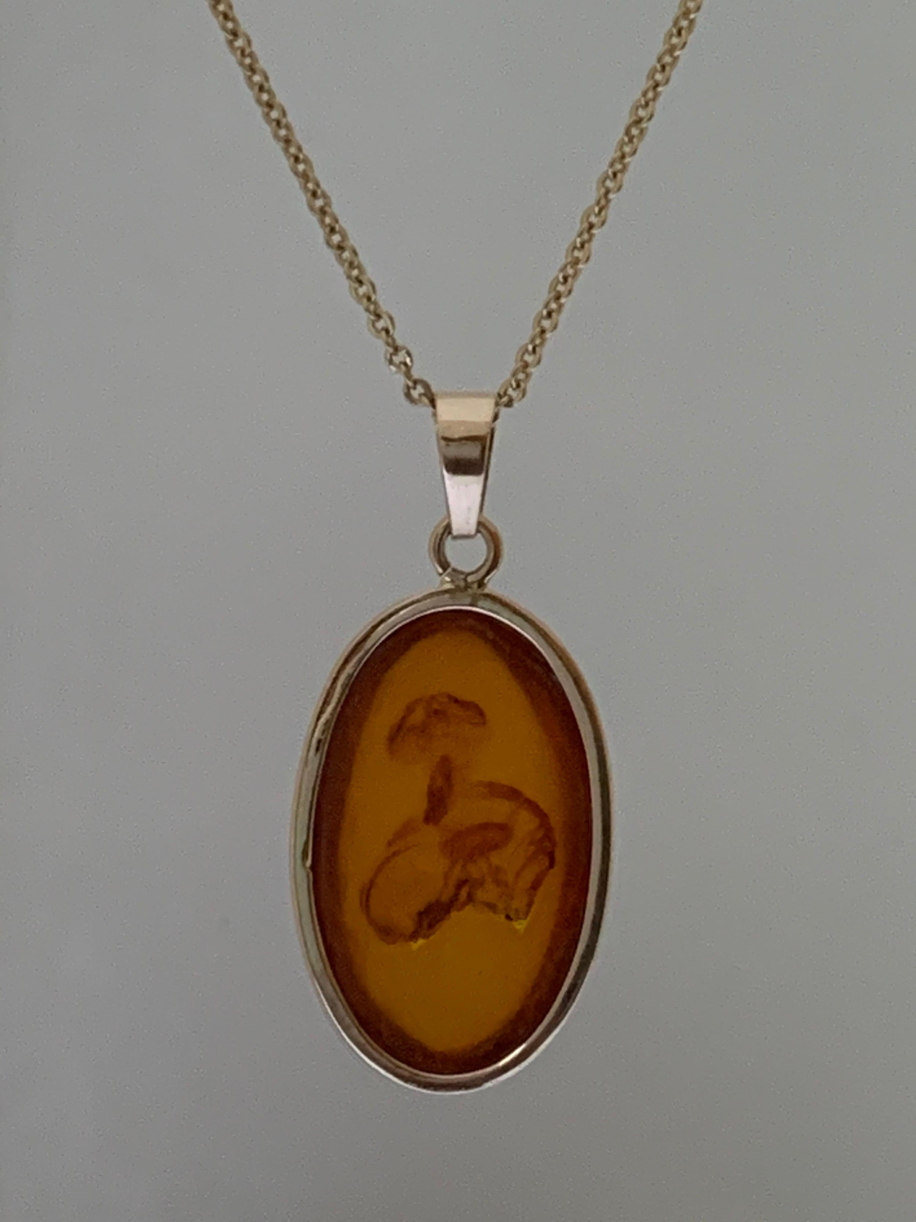 Oval Cut Natural Oval Amber Set in 14 Karat Gold For Sale