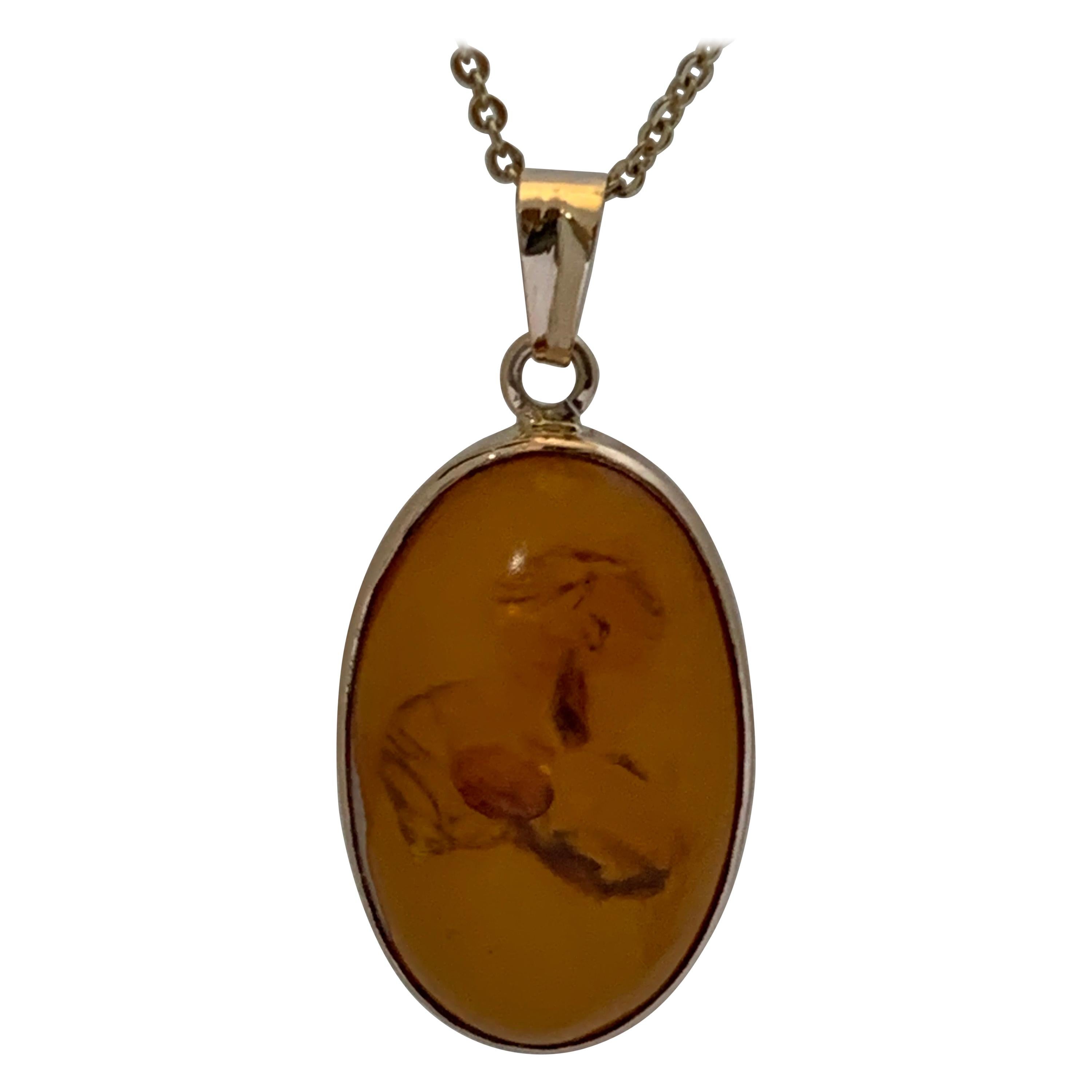 Natural Oval Amber Set in 14 Karat Gold For Sale