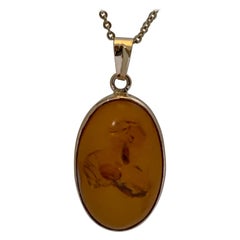 Used Natural Oval Amber Set in 14 Karat Gold
