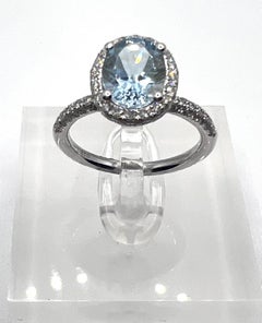 Natural Oval Aquamarine and Diamond Halo Ring in 18k White Gold