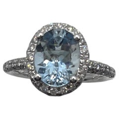 Natural Oval Aquamarine and Diamond Halo Ring in 18k White Gold