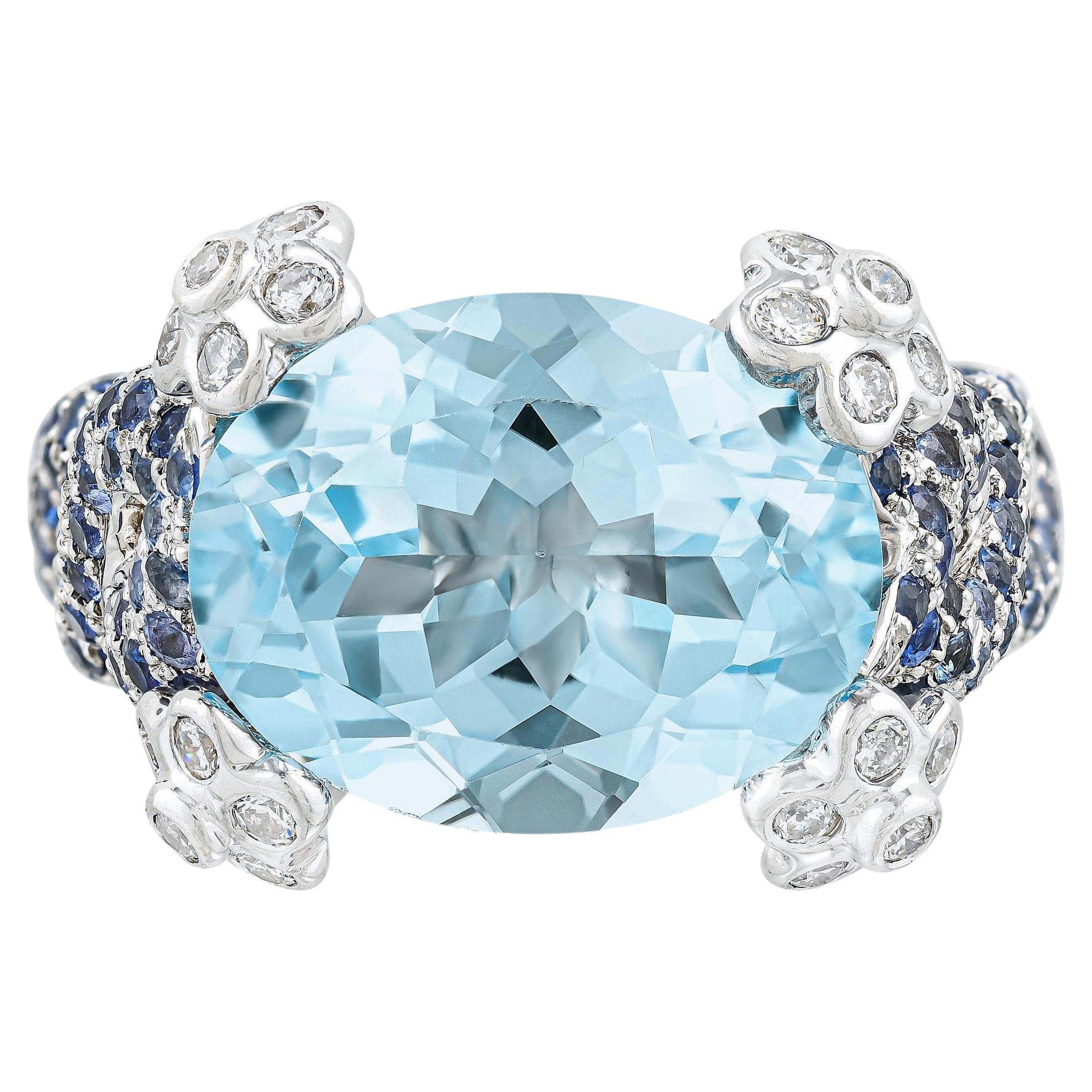 Natural Oval Aquamarine Ring Blue Sapphires and Diamonds Setting 7.79 Carats 18K For Sale