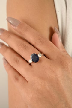 Natural Oval Blue Sapphire and Diamond Three-Stone Engagement Ring in 14k Gold