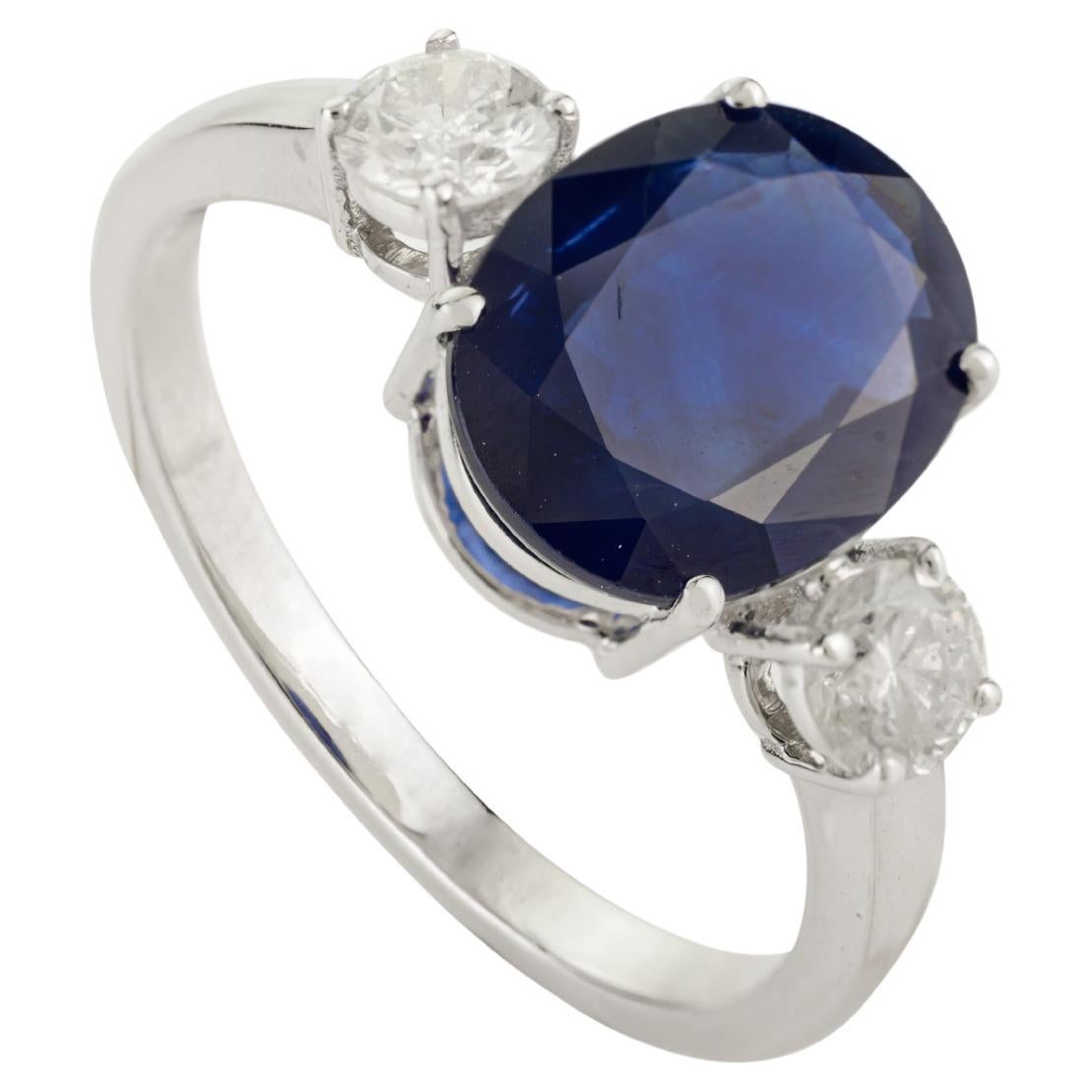 For Sale:  Natural Oval Blue Sapphire and Diamond Three-Stone Engagement Ring in 14k Gold