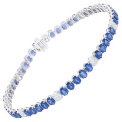 Bracciale tennis con diamanti e zaffiri blu taglio ovale Nature 14 Karat White Gold