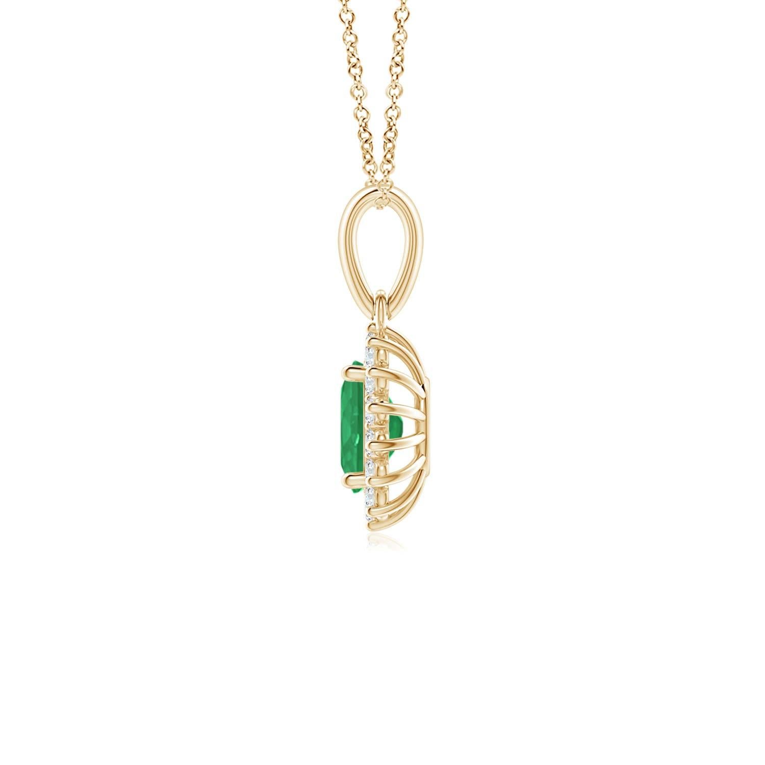 This enchanting emerald and diamond halo dangle pendant will steal hearts with its exquisiteness. An oval lush green emerald at the center is surrounded by sparkling white diamonds to create a beautiful floral design. Sculpted in 14k yellow gold,
