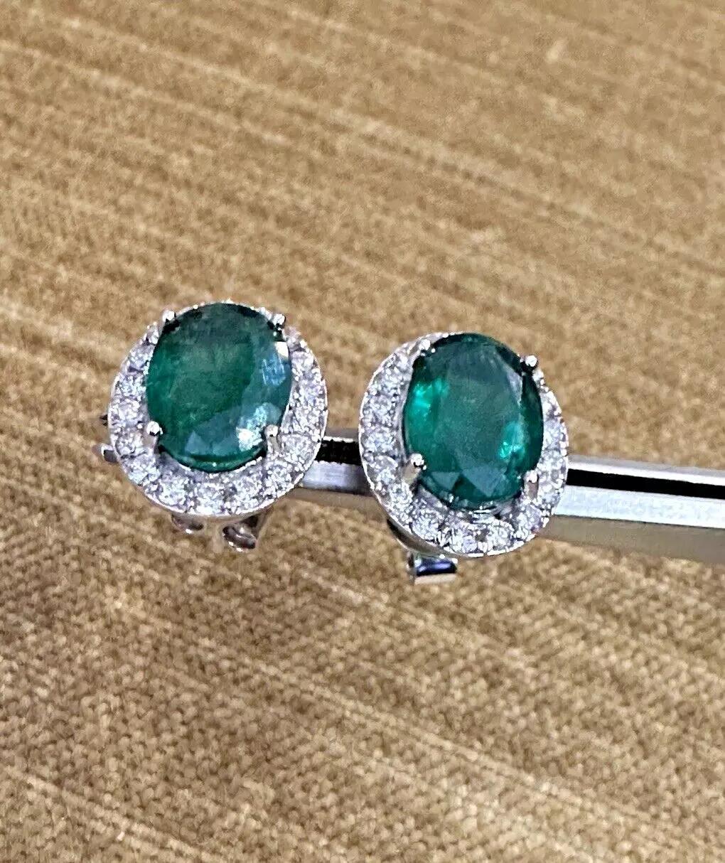 Natural Emerald Stud Earrings with Diamond Halo in 14k White Gold

Natural Emerald and Diamond Earrings feature 2 Natural Emeralds weighing 4.69 carats in total surrounded by a halo of Round Brilliant Diamonds, all set in 14k White Gold.

Total