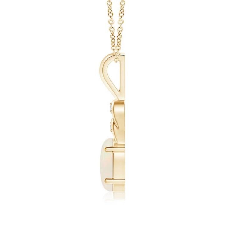 An oval opal hangs gracefully from the 14K yellow gold metal bale exuding remarkable brilliance. The loops above the stone are adorned with shimmering diamond accents that elevate the beauty of this classic opal pendant. Available in different carat