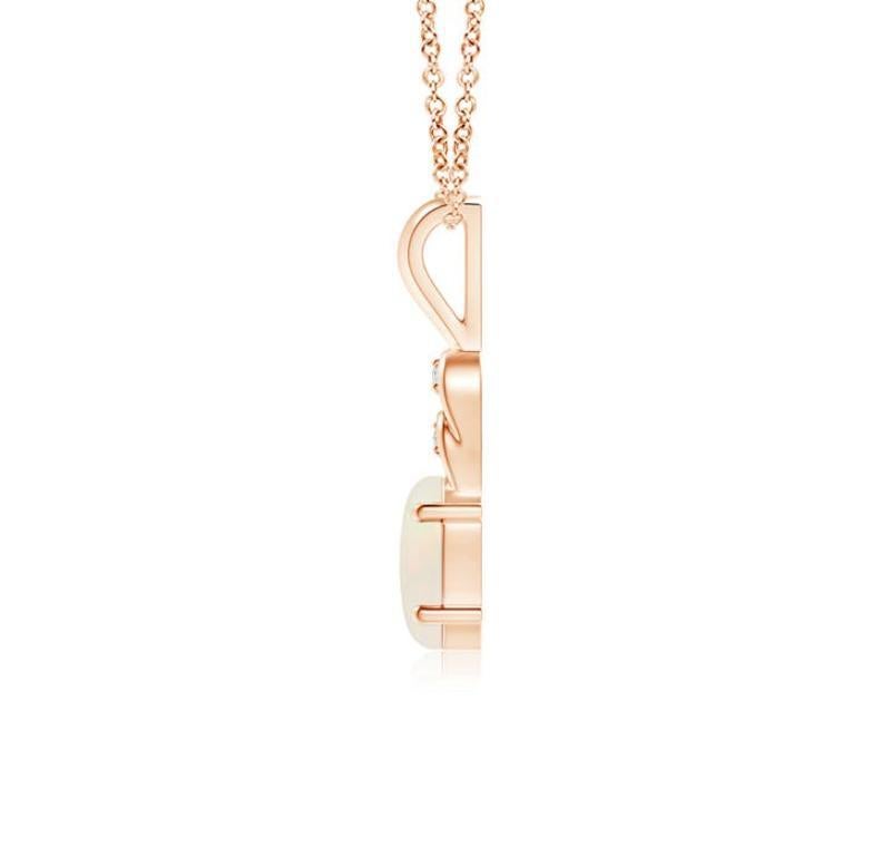 Une opale ovale est suspendue gracieusement à la balle en métal d'or rose 18 carats, dont l'éclat est remarquable. Les boucles au-dessus de la pierre sont ornées de diamants scintillants qui rehaussent la beauté de ce pendentif classique en opale.