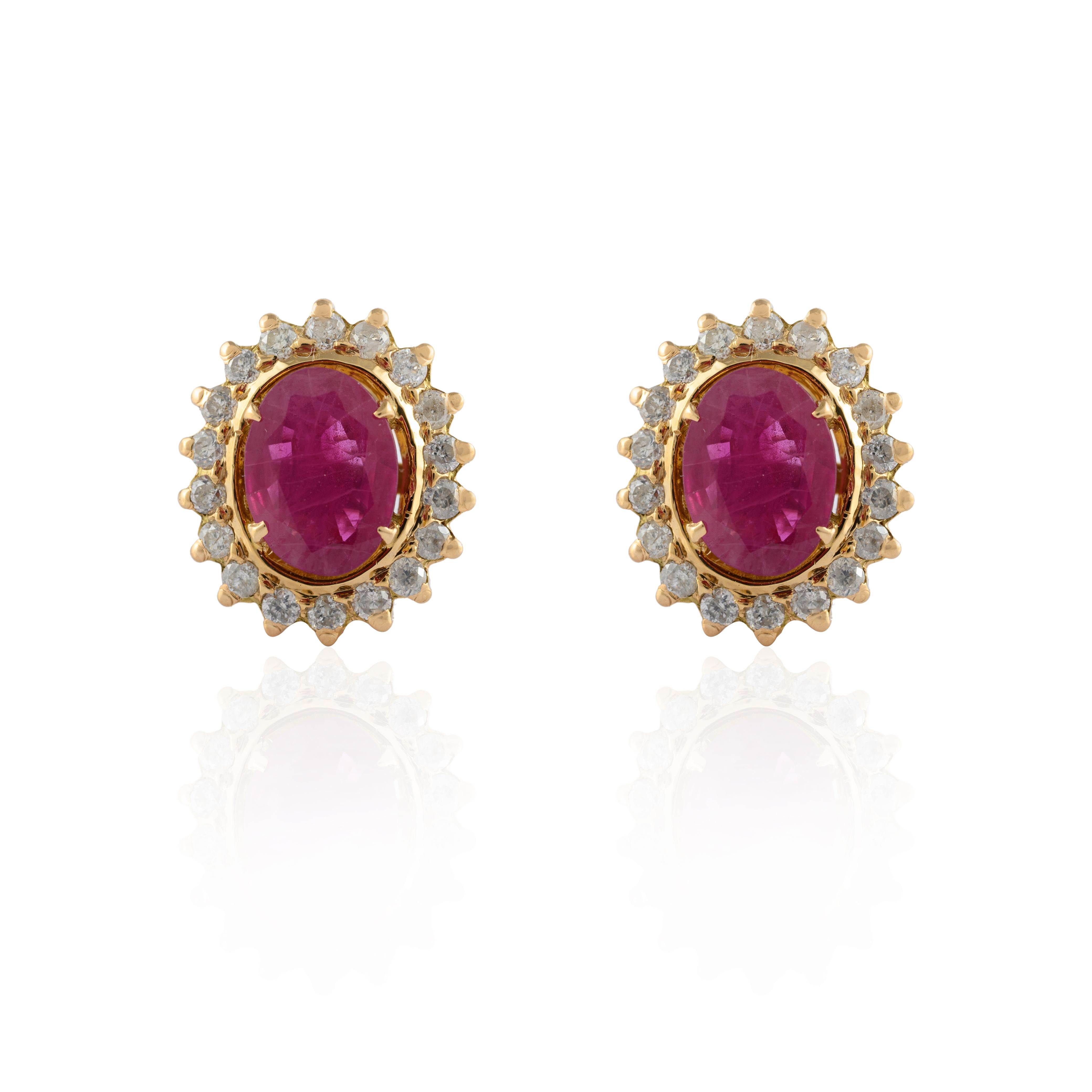 Contemporary Natural Oval Ruby Flower Stud Earrings with Halo Diamonds in 14k Yellow Gold For Sale