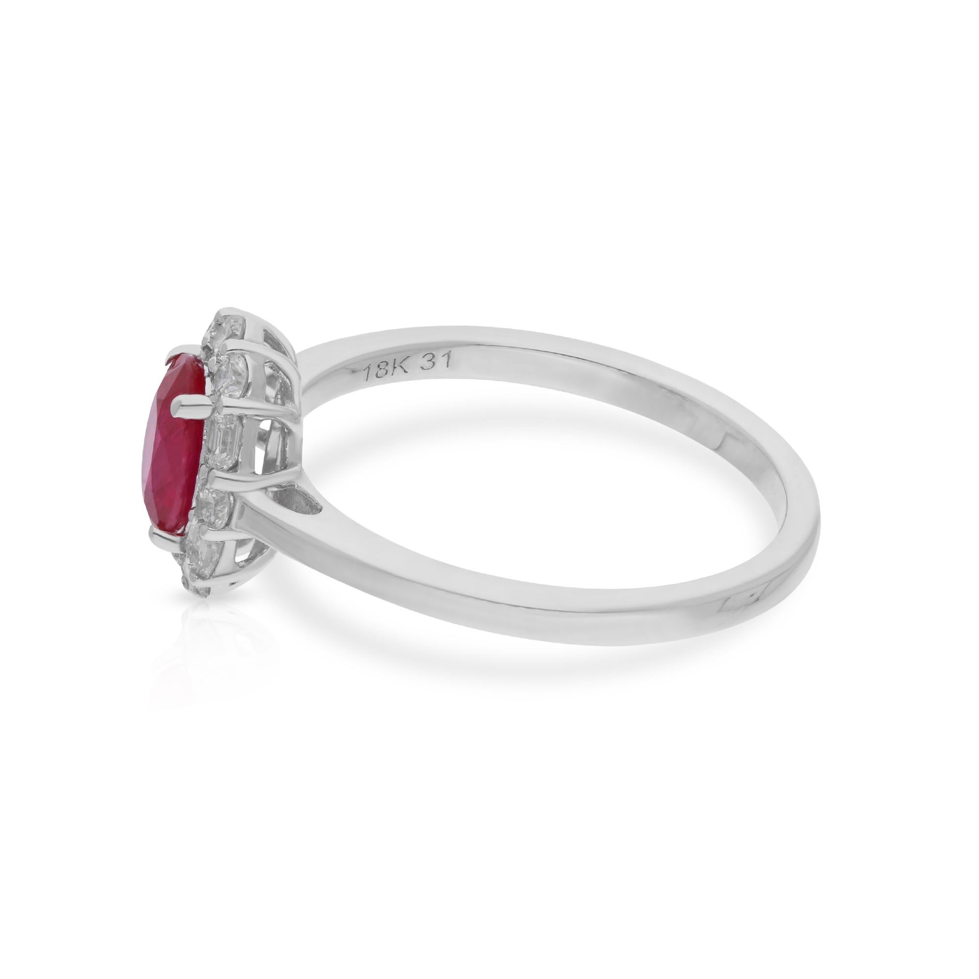 Surrounding the ruby gemstone are dazzling diamonds, meticulously set in lustrous 18 Karat White Gold. Each diamond is carefully selected for its exceptional quality and brilliance, adding a touch of sparkle and luxury to the design. The intricate