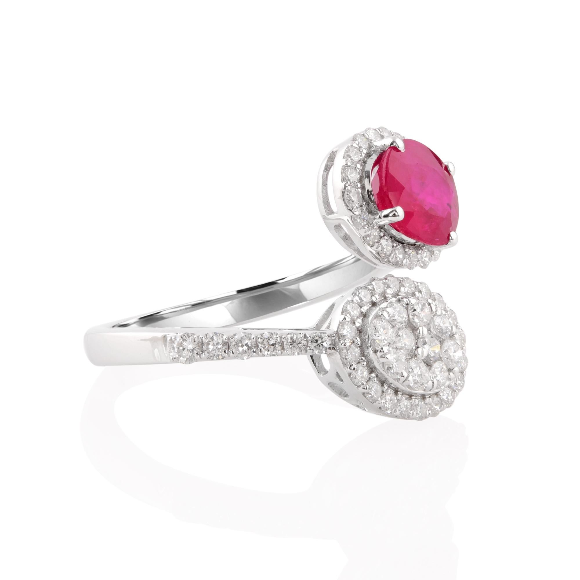 Experience the unparalleled beauty and sophistication of this exquisite Natural Oval Ruby Gemstone Wrap Ring, accented with shimmering diamonds and meticulously crafted in luxurious 18 karat white gold. This stunning piece of fine jewelry is a