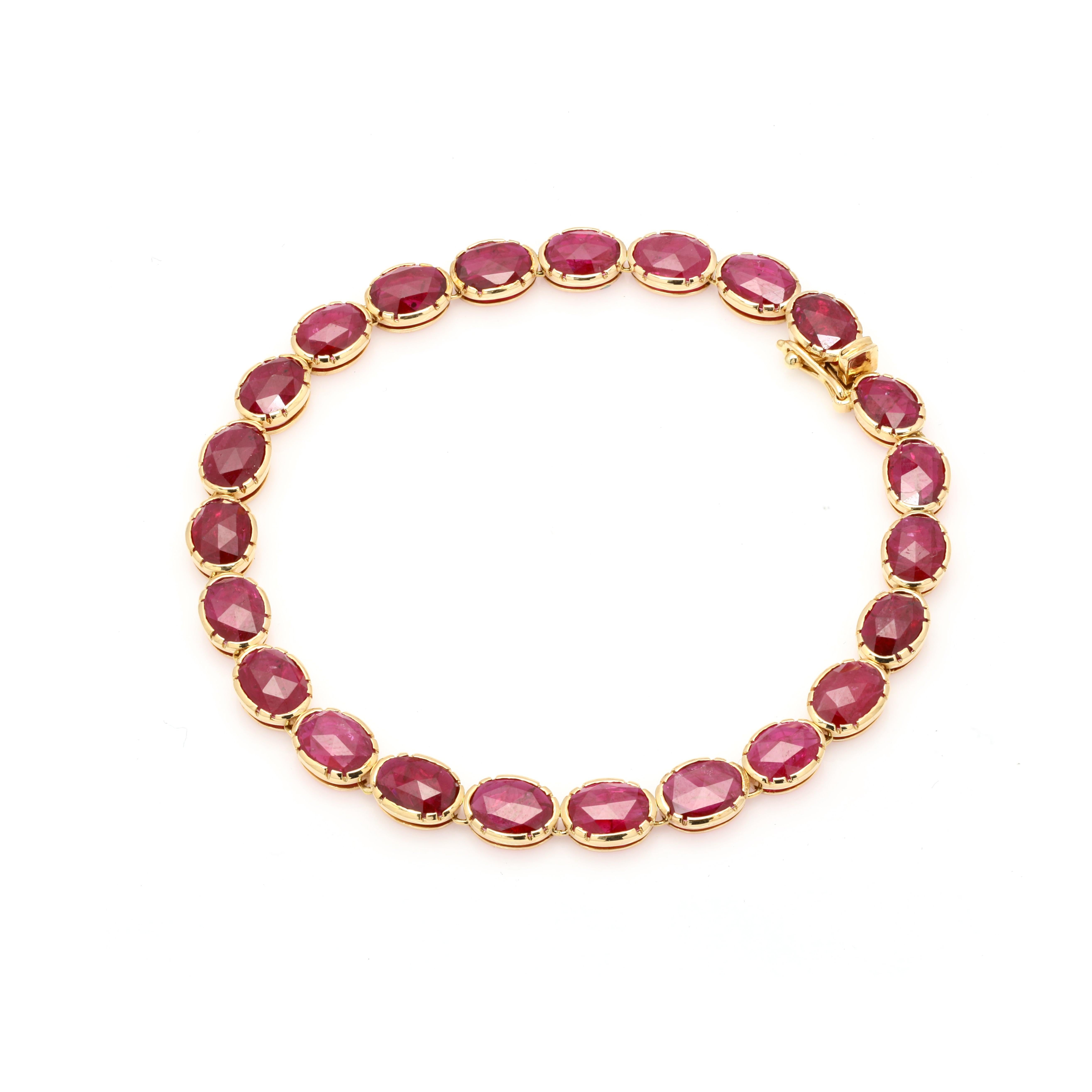 14.65 cts ruby tennis bracelet in 18K gold. It has a perfect oval cut gemstone to make you stand out on any occasion or an event.
Ruby gemstone brings name and fame. 
Featuring 14.65 cts of ruby set in 14K gold pinion bezel, this handcrafted tennis