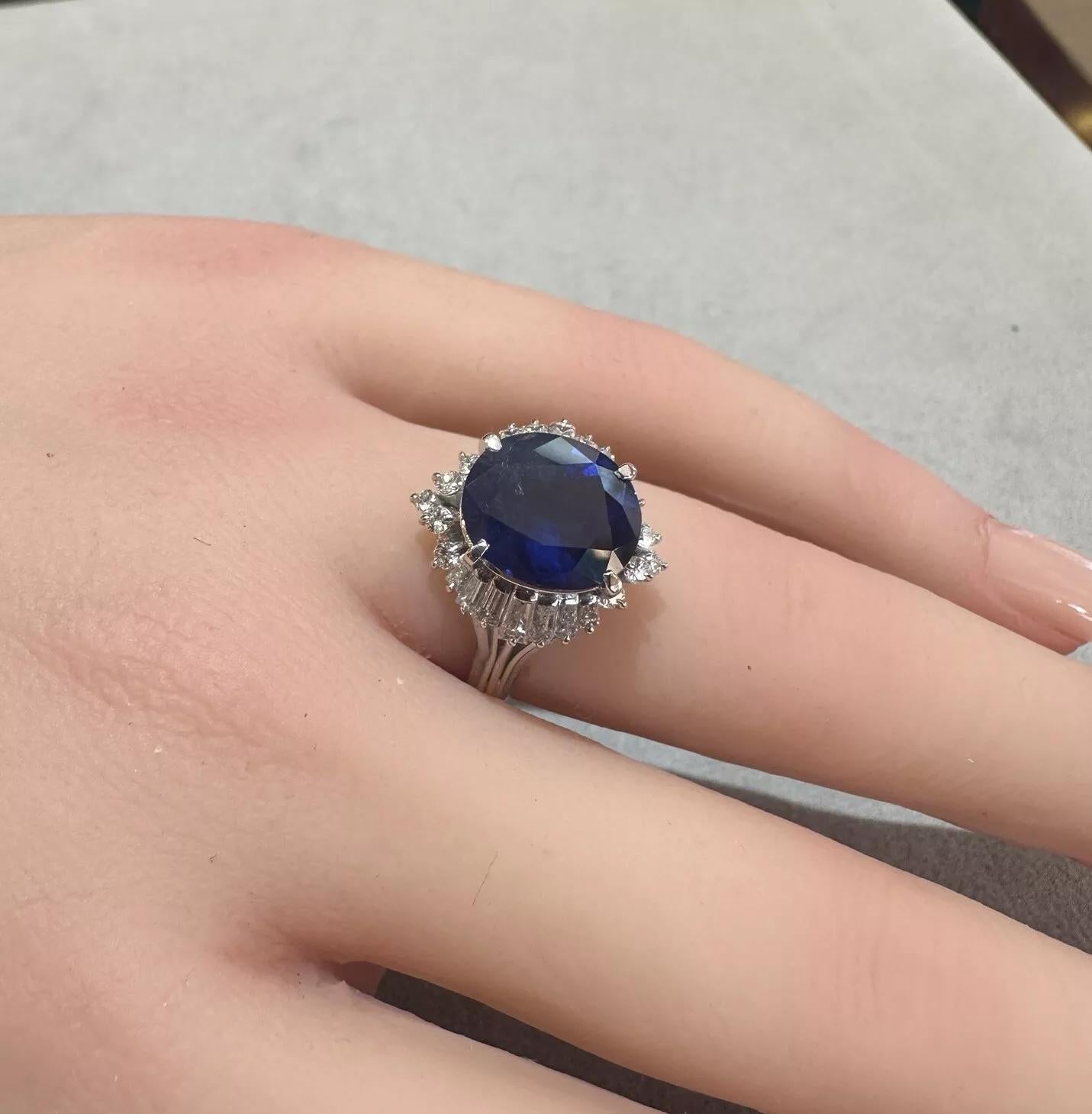 Natural Oval Sapphire 4.42 carat and Diamond Ballerina Ring in Platinum

Sapphire and Diamond Ring features a Natural Dark Blue Oval Sapphire weighing 4.42 carats accented by Natural Round Brilliant cut and Baguette Diamonds, all set in a Platinum