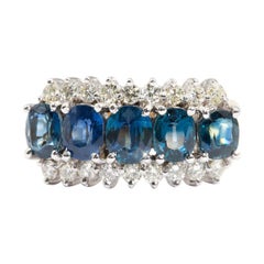 Natural Oval Sapphire and 0.54 Carat Diamond 18 Carat Gold Vintage Cluster Ring Natural Oval Sapphire and 0.54 Carat Diamond 18 Carat Gold Vintage Cluster Ring