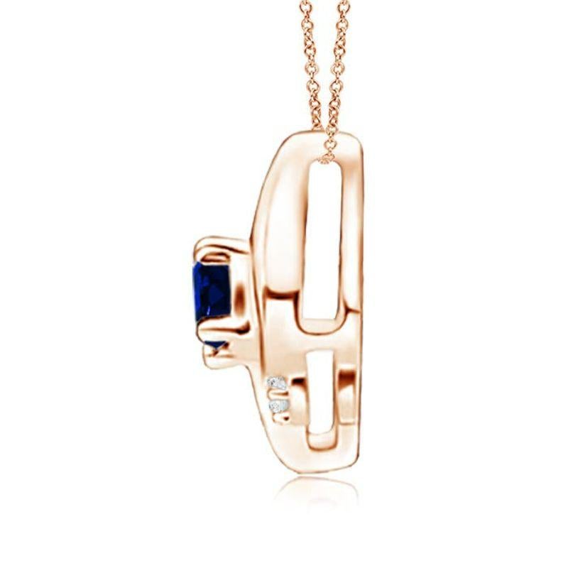 This gorgeous sapphire solitaire pendant features an alluring conch-like frame within which sits an oval, prong set blue sapphire. Sparkling round diamond accents add to the overall allure of the design. This titled oval sapphire pendant is designed