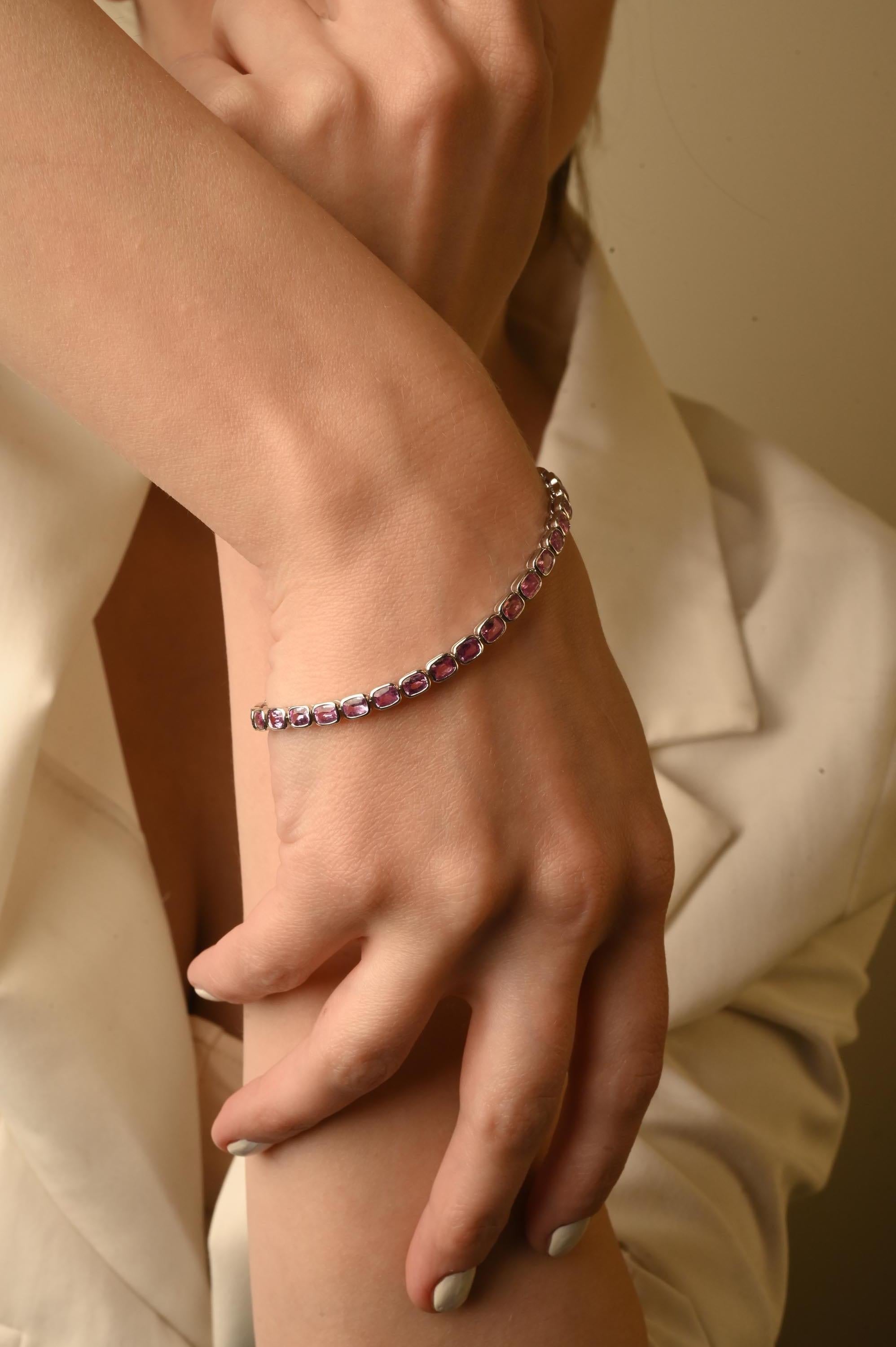 Pink Sapphire bracelet in 18K Gold. It has a perfect oval cut gemstone diamonds to make you stand out on any occasion or an event. 
A tennis bracelet is an essential piece of jewelry when it comes to your wedding day. The sleek and elegant style