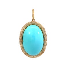 Natural oval shaped turquoise and diamond pendant Natural oval shaped turquoise and diamond pendant