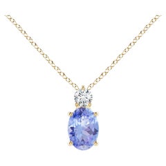 Natural Oval Tanzanite Solitaire Pendant with Diamond in 14K Yellow Gold