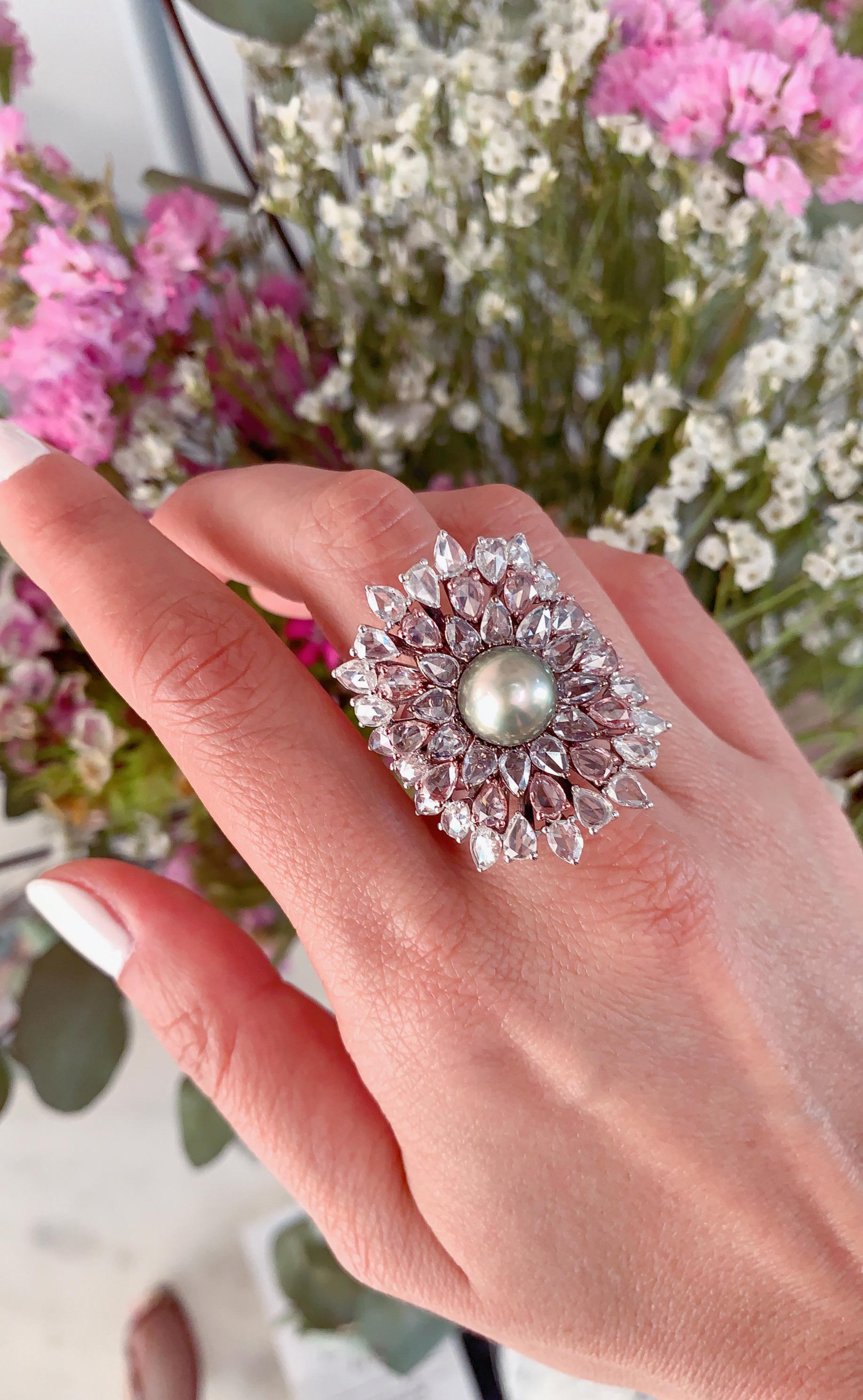 A Natural Pacific Pearl Ring with Rose Cut Diamonds set with PVD coated Gold as part of the Kaleidoscope Collection by Jewelry Designer, Sarah Ho.

This pearl was born from a rainbow-lipped pearl, to honour the kaleidoscope of colors that shimmer
