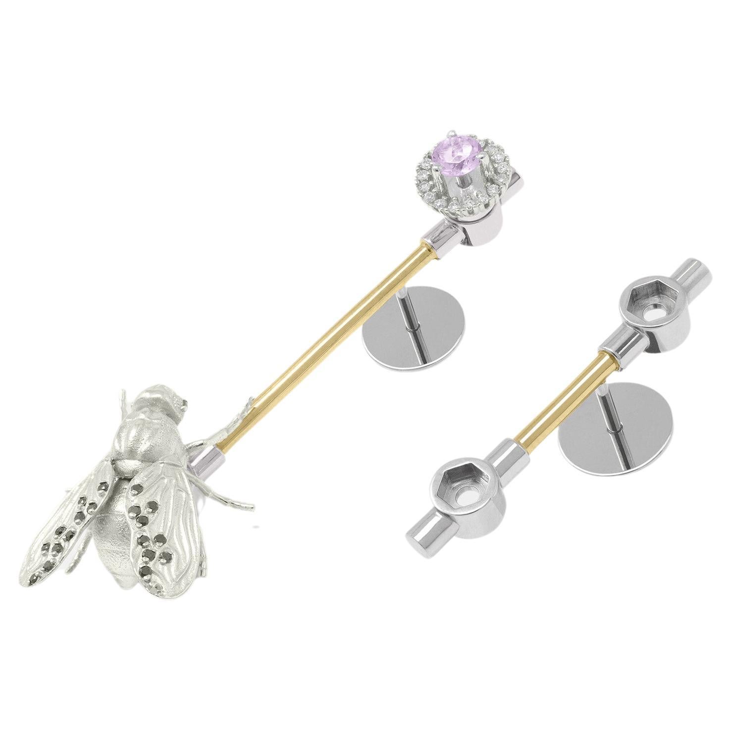 The earrings show a minimal line in yellow gold with a Fly in white gold with black diamonds and a hallo engagement with amethyst and white diamonds.
·Fly white gold 18K with Black Diamonds A (22 units, 1mm Ø)
·Halo Engagement with White Diamonds