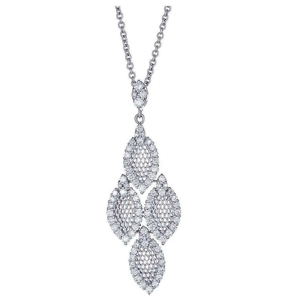 1.0 ct Diamond Drop Cluster Pendant Necklace in 18 karat White Gold

Exquisite and elegant. This pendant necklace encrusted with natural diamonds, in the shape of four marquise-shaped cluster elements, suspended from a beautiful cable chain. Buffed