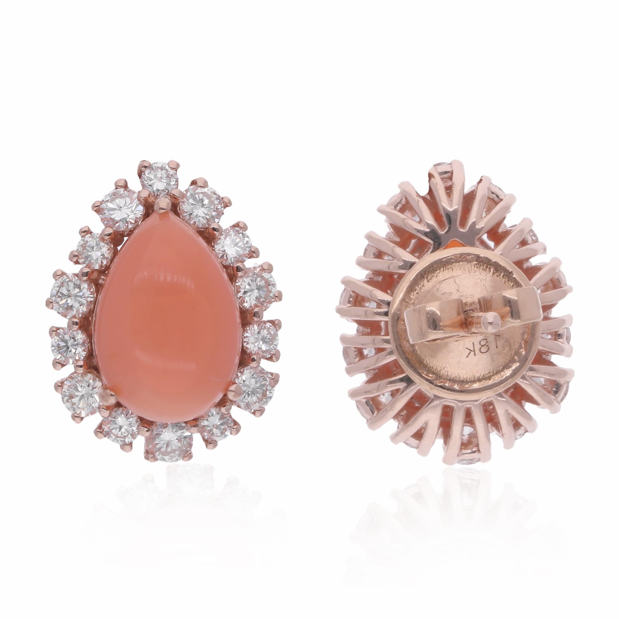 Immerse yourself in the exquisite beauty of these Natural Pear Coral Gemstone Stud Earrings, adorned with dazzling Diamonds and handcrafted in luxurious 18 Karat Rose Gold. These stunning earrings are a testament to elegance and sophistication,