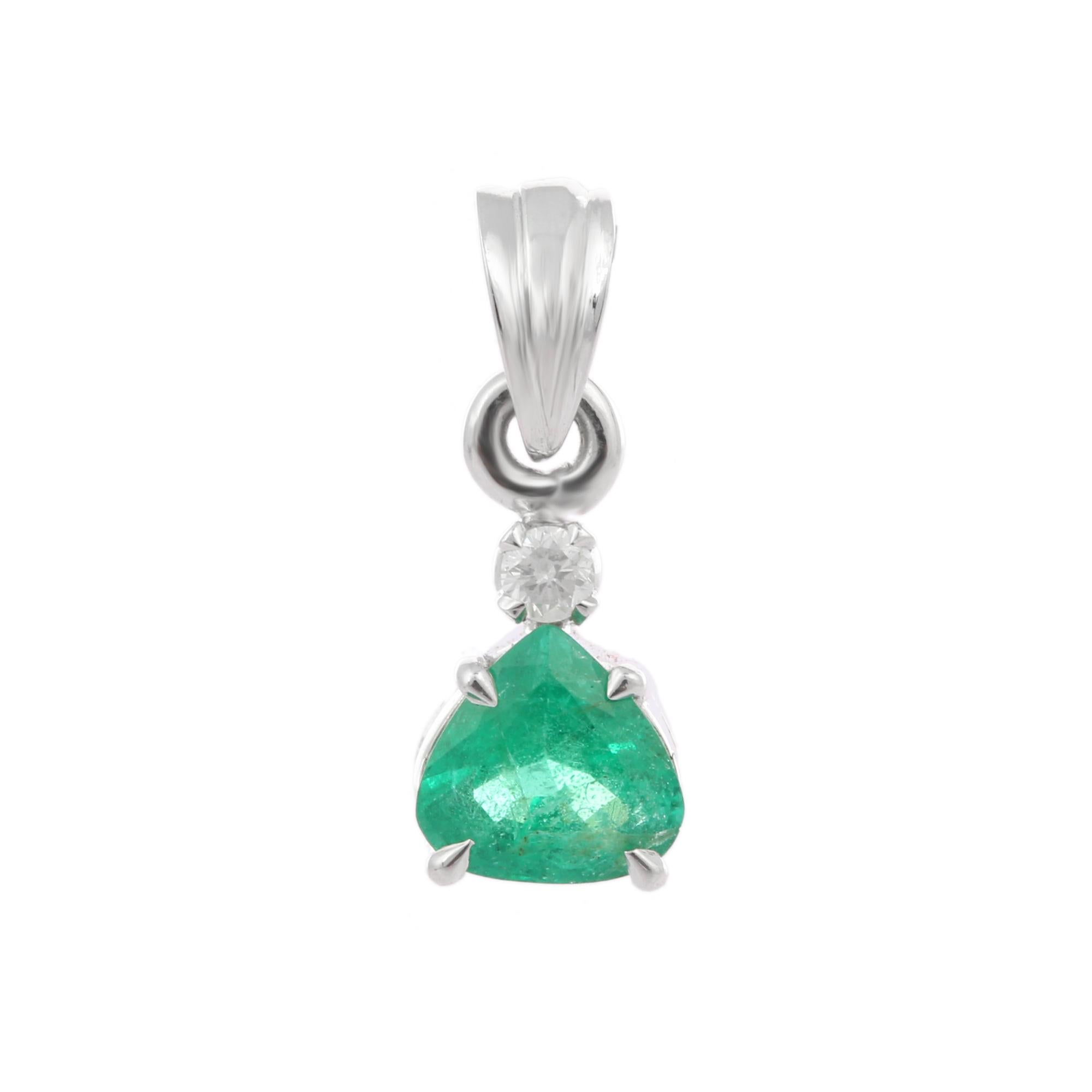 Emerald pendant in 18K Gold. It has a pear cut emerald studded with diamonds that completes your look with a decent touch. Pendants are used to wear or gifted to represent love and promises. It's an attractive jewelry piece that goes with every
