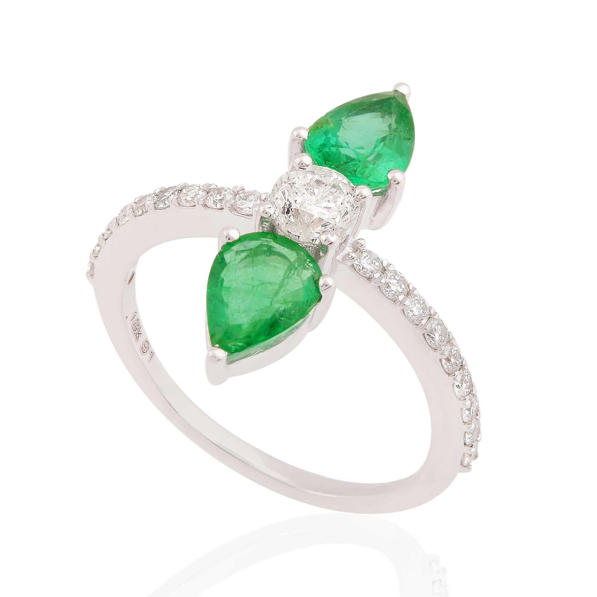 At the center of this ring lies a genuine pear-shaped emerald gemstone, prized for its vivid green hue and exceptional clarity. Mined from the depths of the earth, this precious gemstone exudes a sense of natural beauty and vitality, evoking the