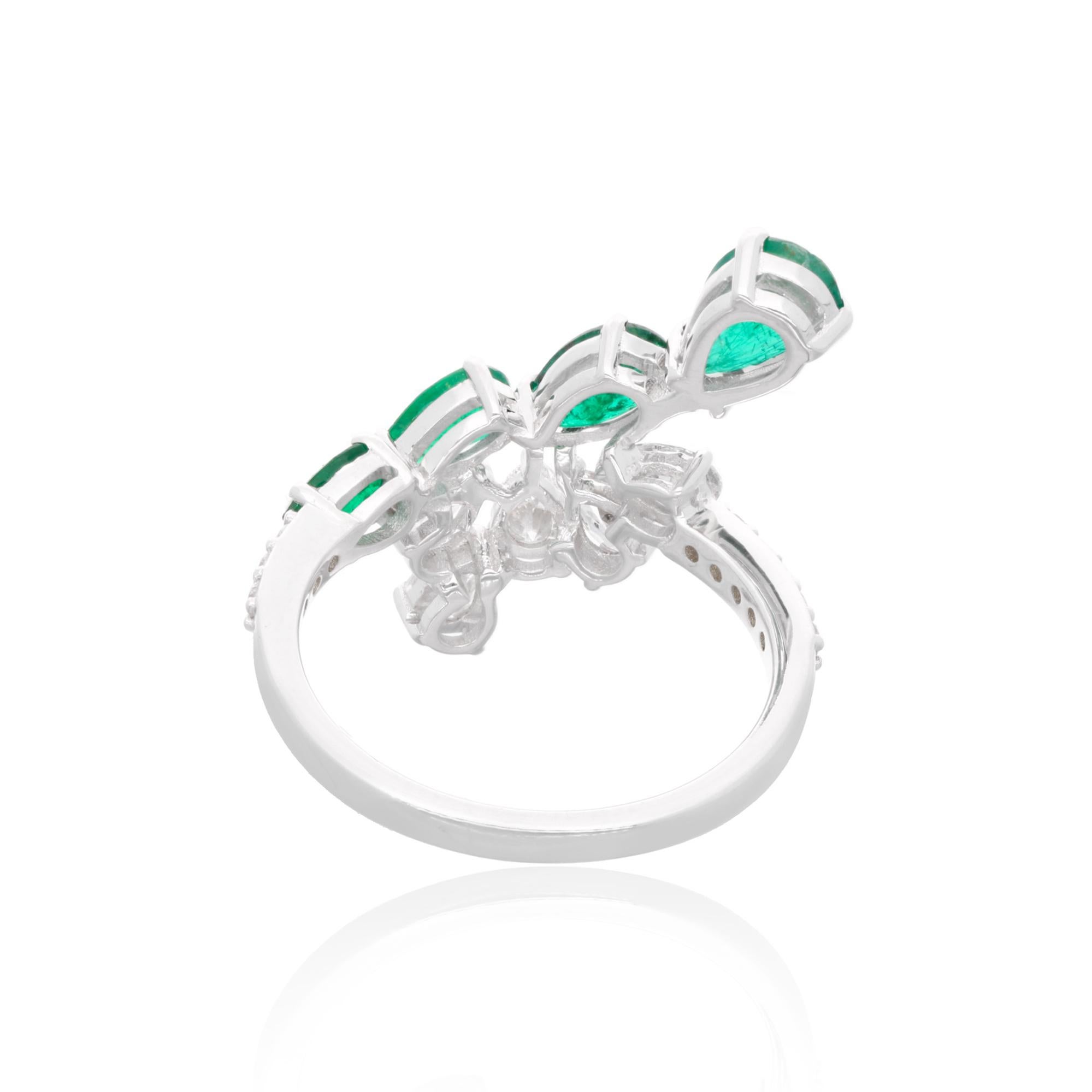 Immerse yourself in the enchanting beauty of this natural pear emerald gemstone ring, accented with dazzling diamonds and meticulously crafted in 14 karat white gold. Each aspect of this exquisite piece of fine handmade jewelry exudes luxury,