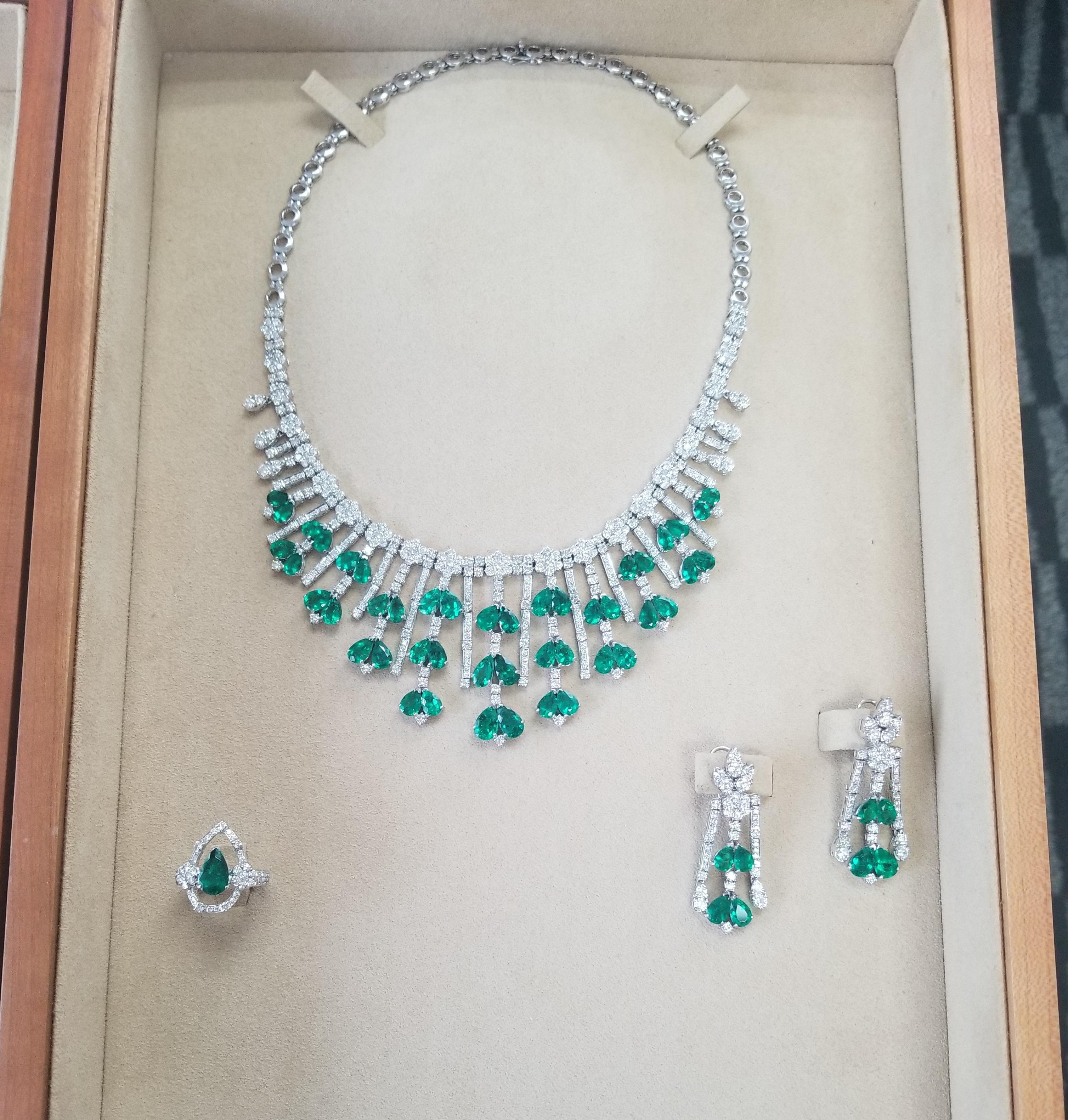 Natural Colombian Pear Shape Emerald and Diamond Set. Certified Set includes a matching Necklace with 46 pieces of emeralds, a pair of ear pendants with 8 pieces of emeralds., and 1 Piece of emerald Ring.

Emeralds Details: Approximately 32.93 total