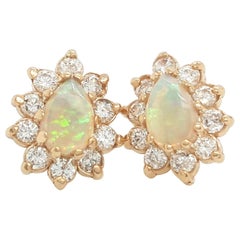 Vintage Natural Pear Shape Opal and Diamond Halo Stud Earrings of 14 Karat Yellow Gold