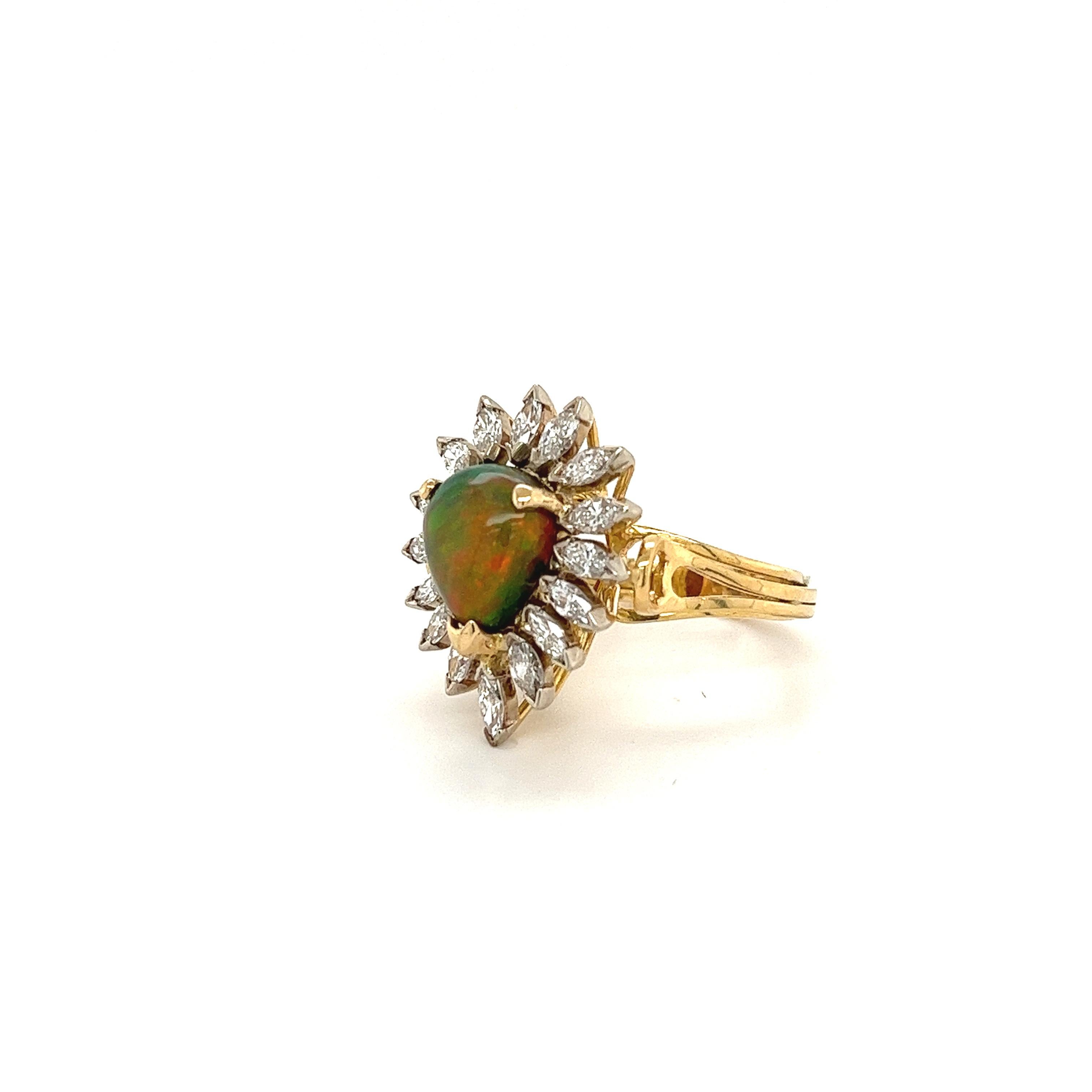3.50-carat natural pear-shaped opal with over 3 carats in a marquise cut natural diamond halo. Euro flair ring shank set in 18 karat solid yellow gold. Polished finish for long-lasting brilliance and shine, Hypoallergenic, and ideal for daily wear. 
