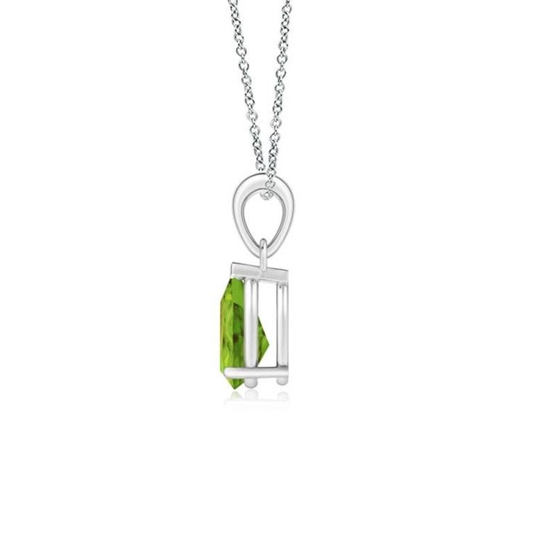 Ce pendentif solitaire classique en péridot charme par sa teinte vert terre. Gracieusement suspendue à une balle en métal brillant, la pierre précieuse en forme de poire sertie est d'une beauté fascinante. Ce pendentif en péridot est réalisé en or