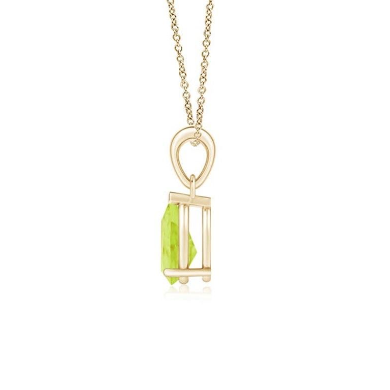 Ce pendentif solitaire classique en péridot charme par sa teinte vert terre. Gracieusement suspendue à une balle en métal brillant, la pierre précieuse en forme de poire sertie est d'une beauté fascinante. Ce pendentif en péridot est réalisé en or