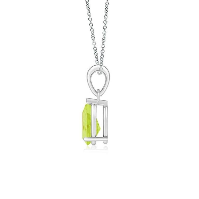 This classic solitaire peridot pendant charms with its earthy green hue. Gracefully suspended from a shiny metal bale, the prong set pear-shaped gem looks fascinatingly beautiful. This peridot dangle pendant is crafted in Platinum. Available in