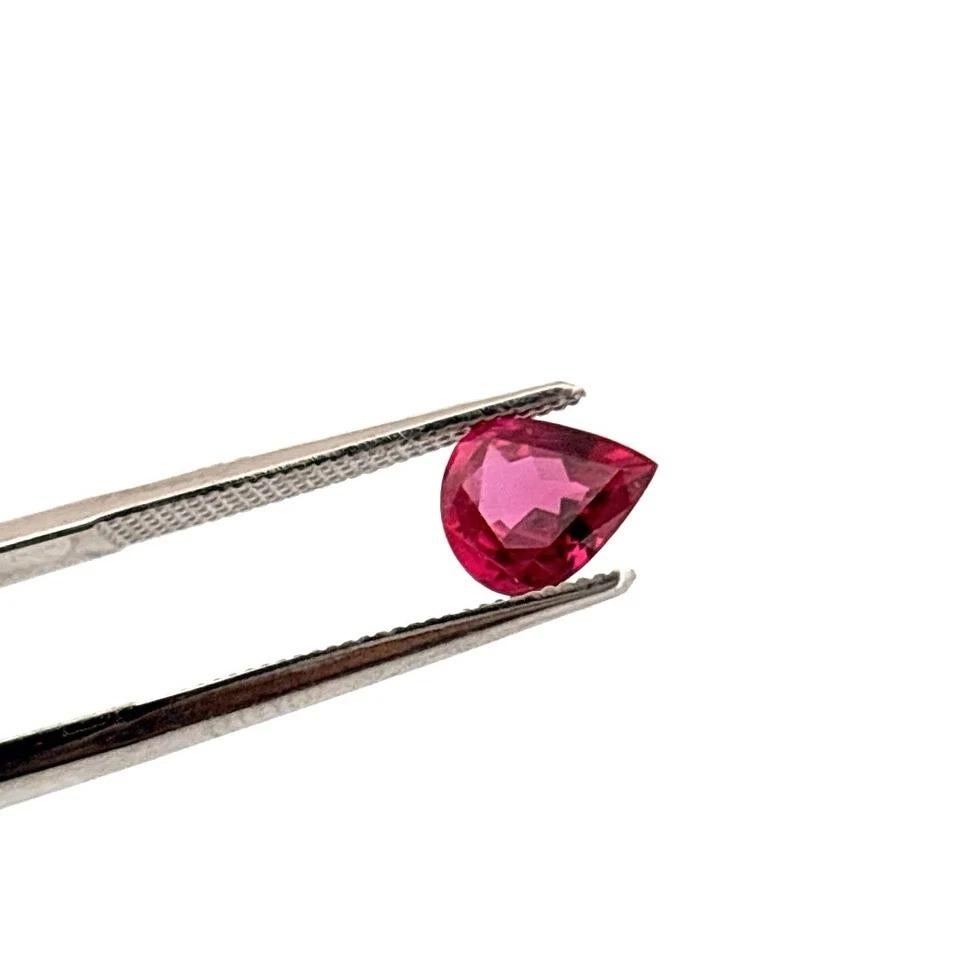 Specifications:

• Gemstone: Natural Ruby
• Weight: 1.36 carats
• Measurements: 7.91 × 6.54 × 3.49 mm
• Shape & Cut:
 ✦ Shape: Pear
 ✦ Cut: Brilliant & Step Cut
• Clarity: Eye Clean (VS)
• Color: Slightly Pinkish/Purplish Red
• Transparency: