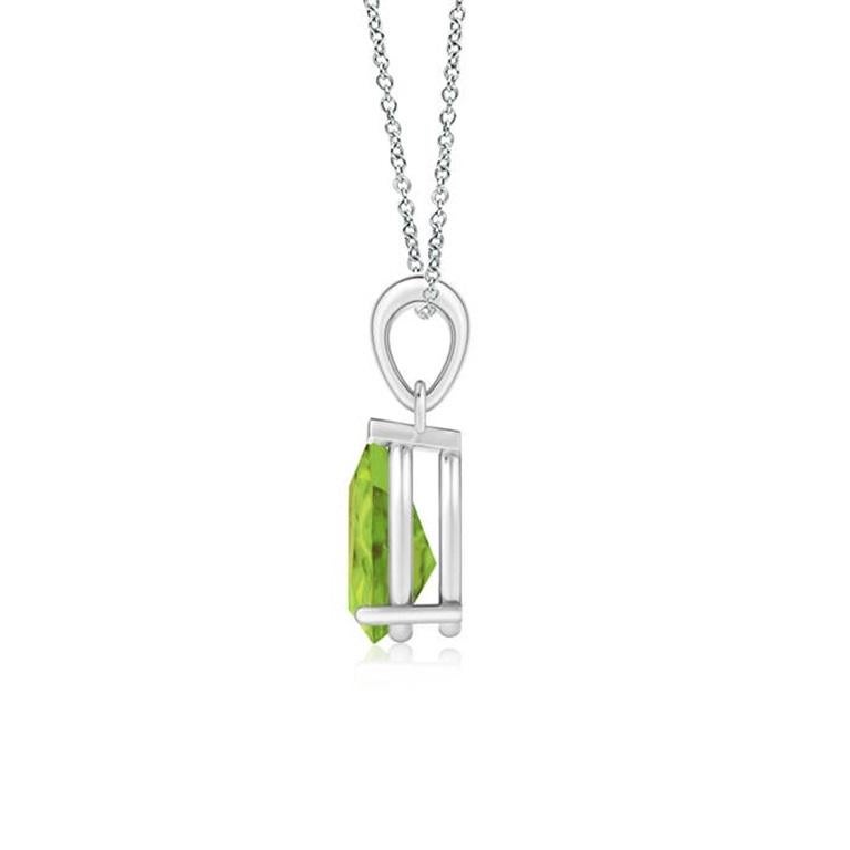 Ce pendentif solitaire classique en péridot charme par sa teinte vert terre. Gracieusement suspendue à une balle en métal brillant, la pierre précieuse en forme de poire sertie est d'une beauté fascinante. Ce pendentif en péridot est réalisé en or