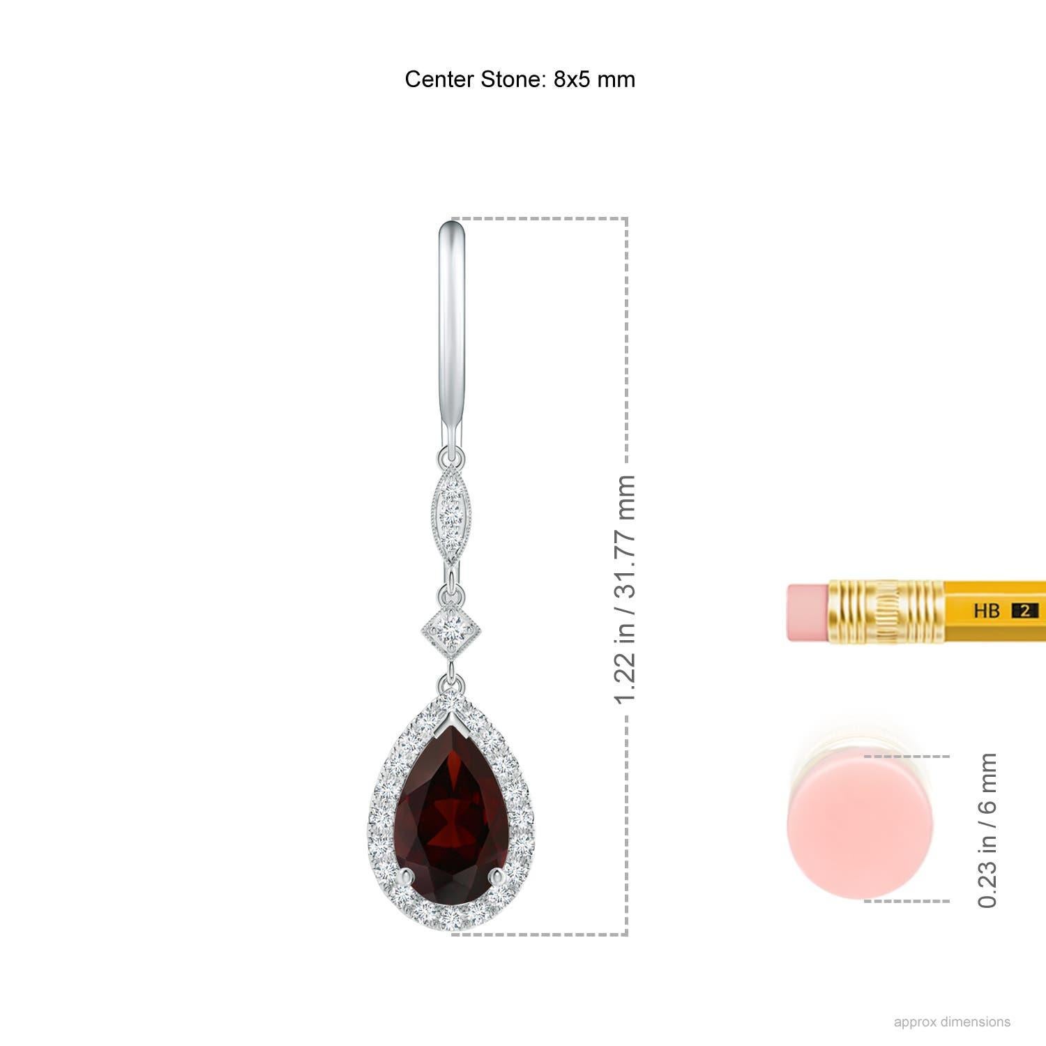 Dangling from shepherd hooks are these beautifully crafted garnet dangle earrings in 14K white gold. Pear-shaped garnets are illuminated by a halo of precious white diamonds that create a remarkable contrast. They are connected to station diamonds