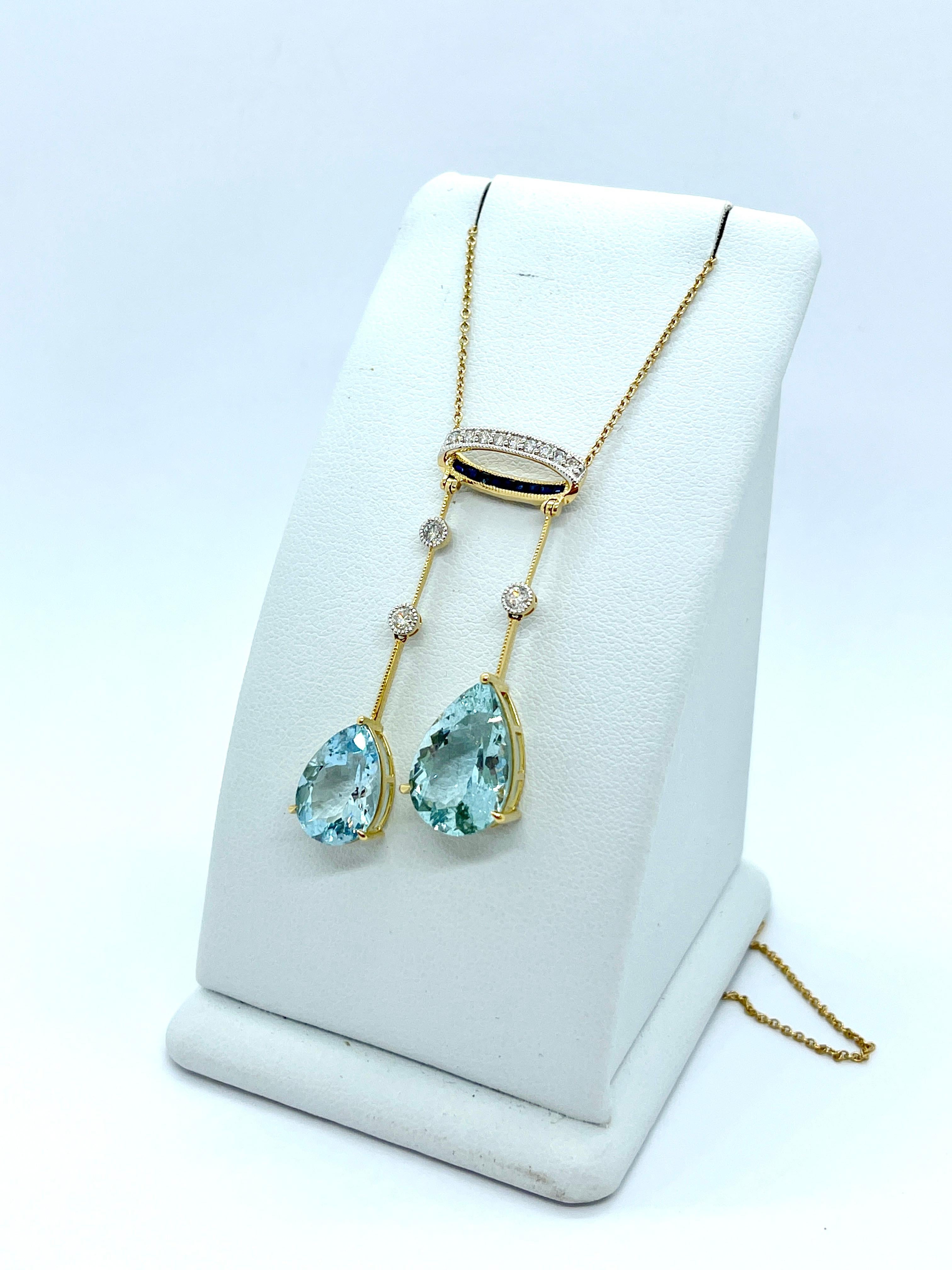 We Proudly Present this Beautiful Necklace

This stunning Aquamarine drop pendant is set with 2 x Natural Pear Shaped Aquarmarine, Diamonds and Blue Sapphires.

The Aquamarine dangle elegantly from a rounded mount that is reminiscent of a small