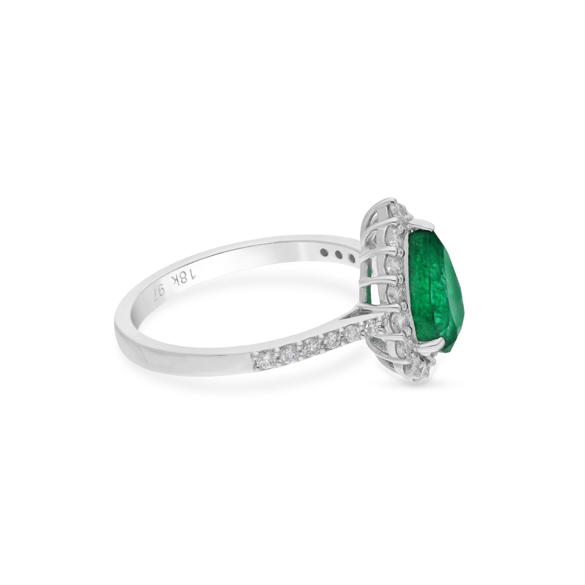 Step into the realm of timeless elegance with this exquisite Natural Pear Zambian Emerald Gemstone Ring, accented with sparkling diamonds and meticulously crafted in 18 karat white gold. At the heart of this captivating ring lies a luscious