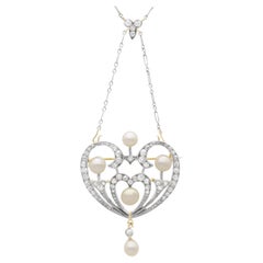 Natural Pearl 0.95 Carat Diamond, 12k Yellow Gold Pendant Brooch Circa 1900