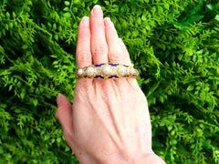 Natural Pearl and 0.64 Carat Diamond Enamel 20k Yellow Gold Bangle Circa 1865