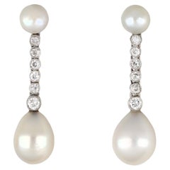 Natural pearl and diamond earrings, circa 1920. 