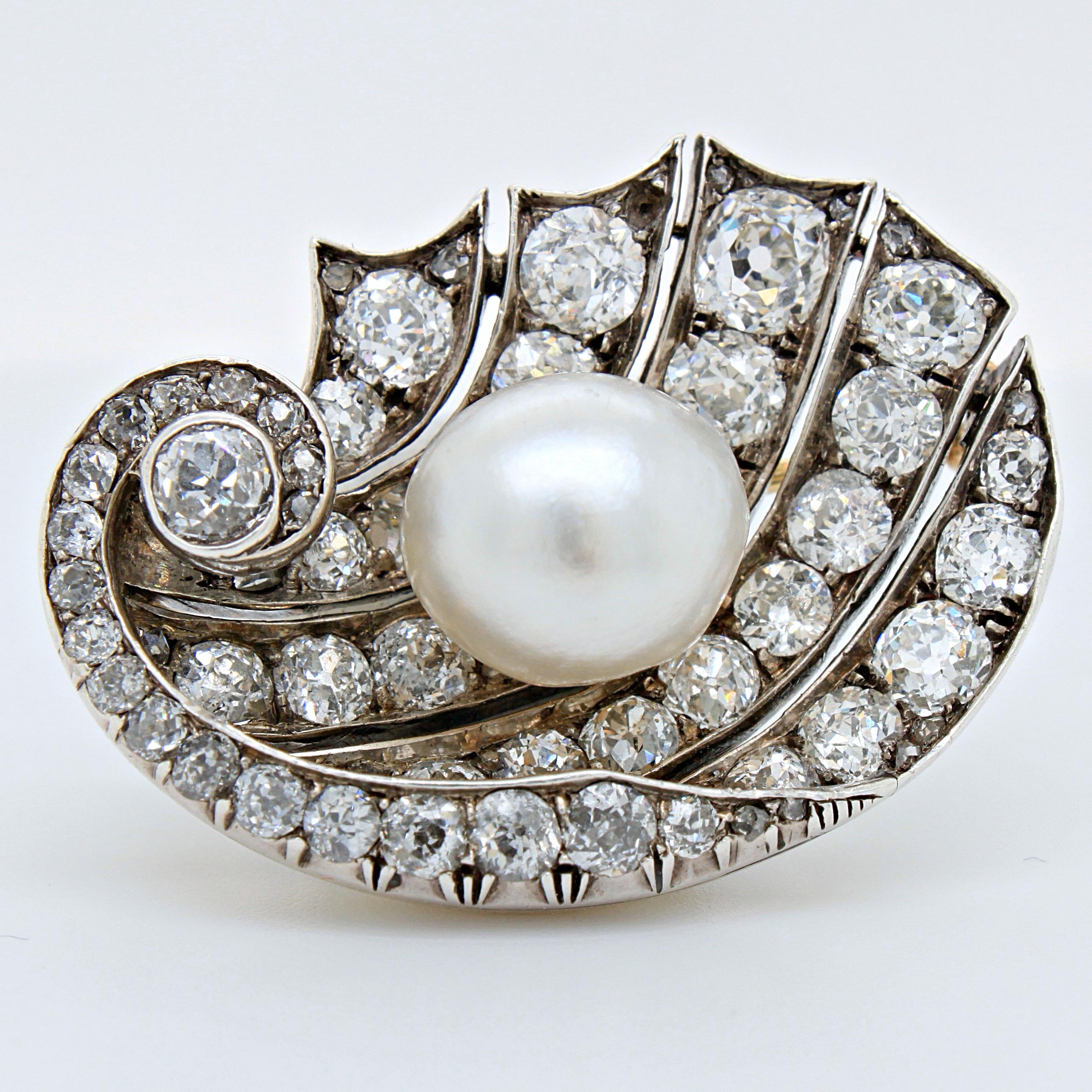 A surreal natural saltwater pearl and diamond maritime brooch, ca. 1900s, Austrian. The brooch is centred with a large round shaped natural saltwater pearl, weighing 7.11 carats (10.78 x 9.65 x 9.83 mm), with a beautiful white colour and lustre -