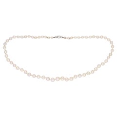 Natural pearl and diamond necklace, circa 1910. 