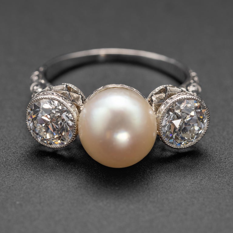 This is a magnificent Edwardian Era (circa 1905) GIA-certified natural (uncultured) saltwater pearl and diamond ring, fabricated by hand in platinum by the oldest jeweler in America, Black, Starr & Frost.

Have you ever seen a thing that was so