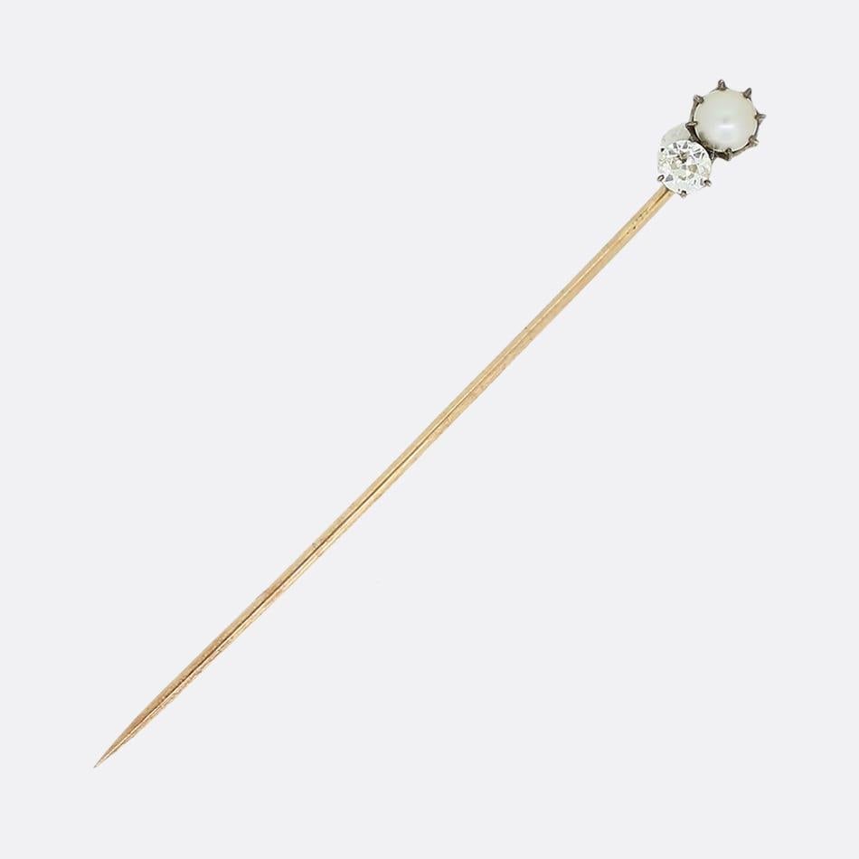 This is a pearl and old cut diamond stick pin. The pin consists of one claw set pearl with an old cut diamond set below in yellow gold.

Condition: Used (Very Good)
Weight: 1.2 grams
Diamond Carat Weight: Approx. 0.18 Carats
Dimensions: 9mm x 5mm x